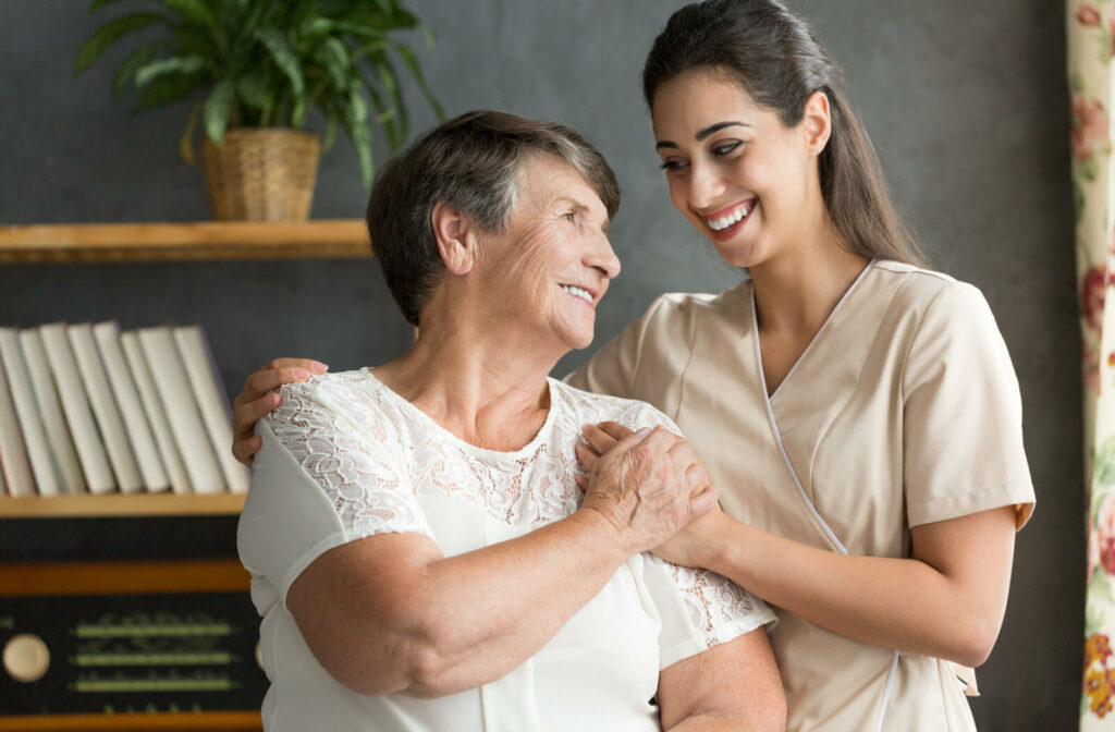 A senior woman is feeling happy with her new respite care professional.